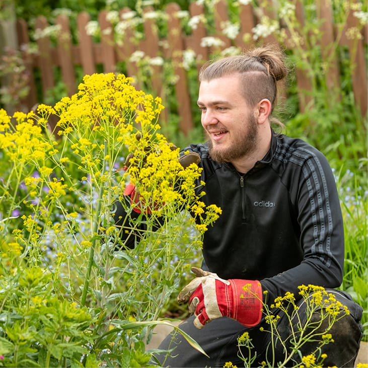 Photo of man working in a garden
